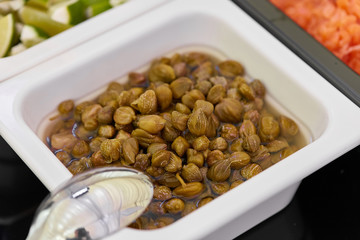 A tray of capers on a plate