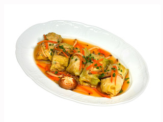 Vegetarian cabbage rolls and vegetables with herb sauce
