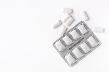 Chewing gum on a beautiful white background with space for your inscription.