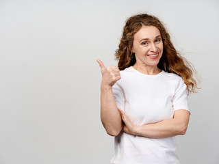 young woman showing thumbs up