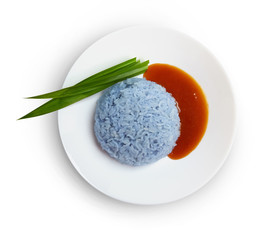 Sticky rice, coconut jam and pandan leaf on plate isolated on white background