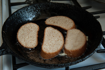 Home cooking. Frying pan with French toast close-up. Selective focus.
