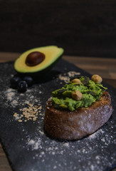 Vegan breakfast with avocado toast, pumpkin seeds and hazelnuts