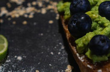 Vegan breakfast with avocado and blueberry toast