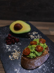 Vegan breakfast with avocado toast and tomato cherry