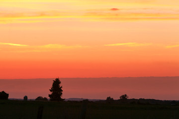Pink, purple, orange, yellow layered sunset.