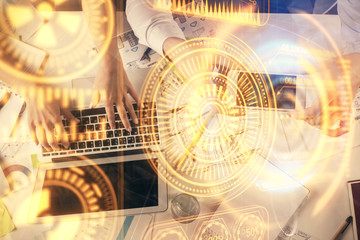 Double exposure of man and woman working together and technology theme drawing. Computer background. Top View. High tech concept.