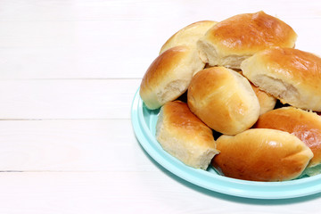 Sweet pie.Baked bun on a wooden background. Baked rolls.