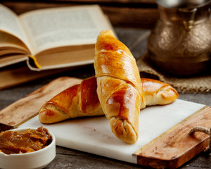 long-shaped sweet bun filled with jam