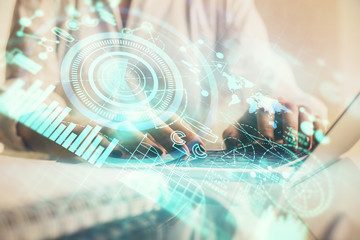 Double exposure of woman hands typing on computer and business theme hologram drawing. Success concept.