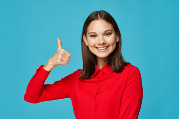young woman showing thumbs up