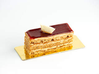 portioned layered cake topped with cherry glaze