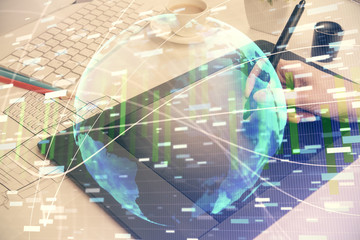 Double exposure of business theme sketch hologram and woman holding and using a mobile device.