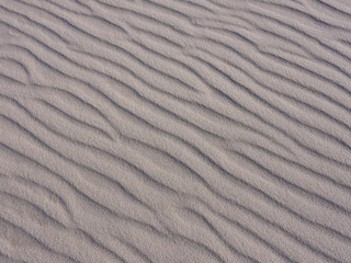 Wind and water patterns carved into the sands of Island Beach State Park in New Jersey with late afternoon light