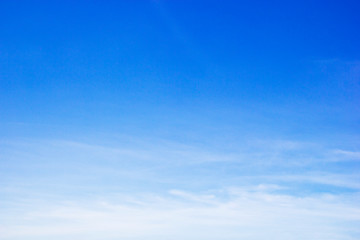 Blue sky background and white clouds soft focus, and copy space