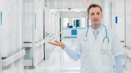 portrait of caucasian male medical doctor with stethoscope in hospital