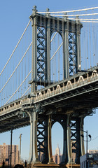 Fototapeta premium Manhattan Bridge with Empire State Building in the distance.