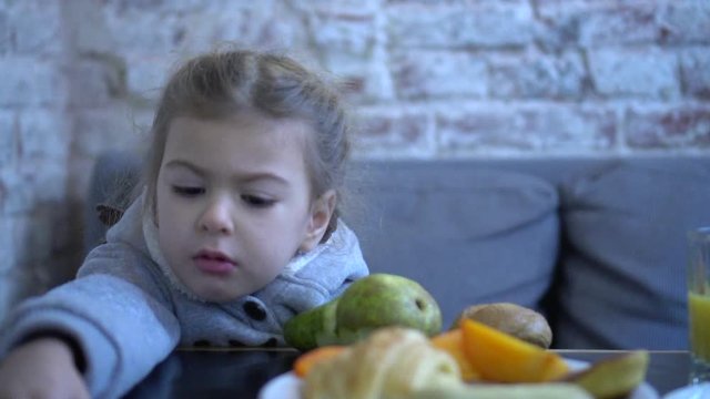 Child Eating Fruits.  Healthy Food And Nutrition. Choosy Kid Not Wanting To Eat.