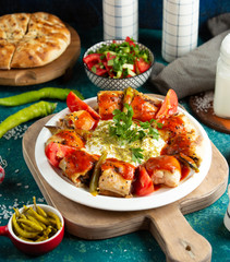 turkish dish beyti kebab with beef wrapped in flatbread served with tomato sauce