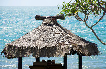 Man resting on the beach near the ocean