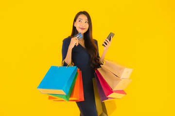 Fototapeta premium Portrait beautiful young asian woman with shopping bag