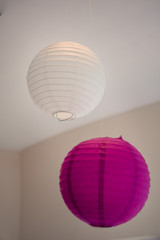 Paper decorations on the festive table in pink and white.