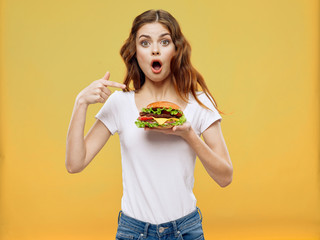 young woman eating a cake