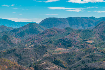 Fototapeta premium Panoramic view of mountains on blue sky