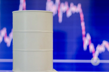 Falling oil prices. A barrel of white color without inscriptions, located on the background of a...