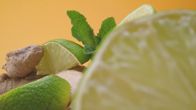 Sliced lime with fresh mint and ginger root