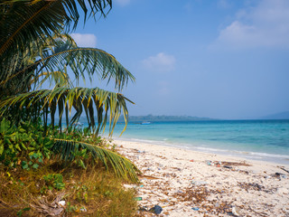 Accumulated filth on the beautiful white sand Govindnagar beach in Havelock islands, Andamans, India