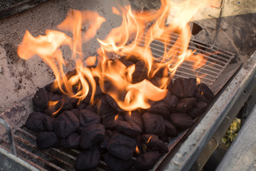 Charcoal on fire in grill