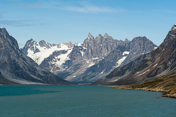 A close up view of the three peaks in a Fjord in Greenland.