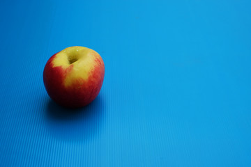 Two color tones apple on blue background