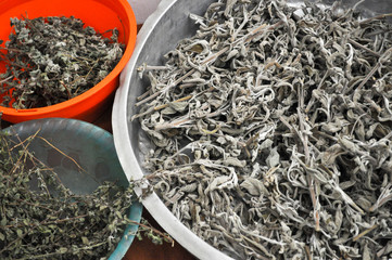 Sage herbs left out to dry in bowls