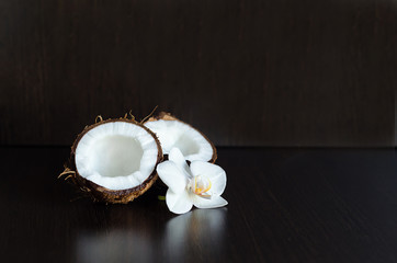 Fototapeta na wymiar tropical exotic fruit, coconut flesh on dark wooden background, copy space