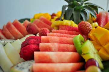 Exotic sliced fresh fruits platter arrangement