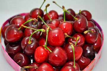 Pile of fresh red cherries with stems