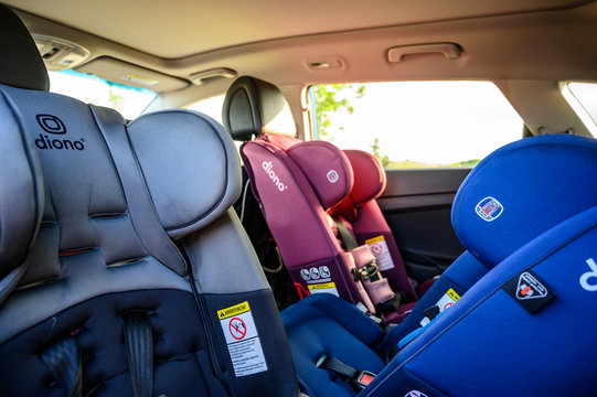 Tiffin, Iowa, USA - 7/2019: Row Of Rear And Forward Facing Diono Car Seats In Back Seat Of SUV