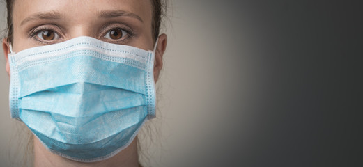 Woman with face mask. Doctor or medical face mask. Protection from all viruses and bacteria. Banner panorama medical staff preventive gear. Copy space.