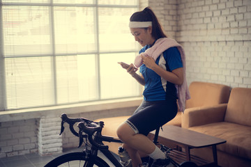 Cyclists upload application statistics She is riding a bike in home