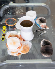 Close-up of a tattooist in the workplace, parts and paints, machines and other equipment