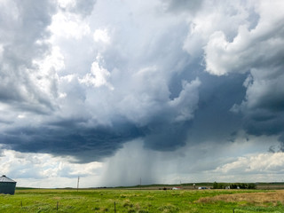 Obraz na płótnie Canvas Strong storm over an open farm field
