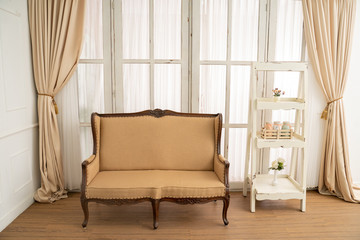 Classic wooden armchairs and simple stacking shelves with window background