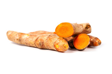 Close up of cutting of turmeric roots on white background, Herbs