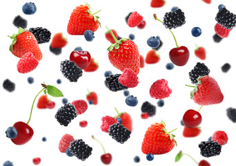Set of falling sweet berries on white background