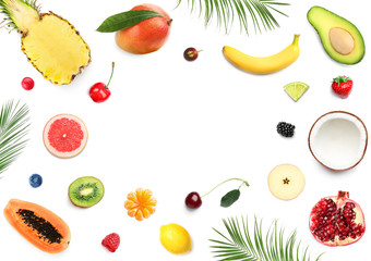 Frame made with different fruits on white background, flat lay