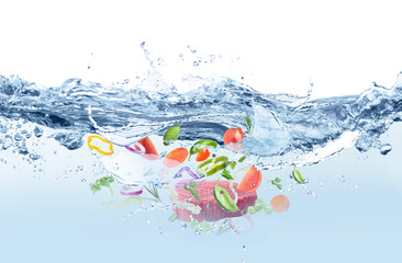 Many different ingredients in water with splashes. Soup recipe