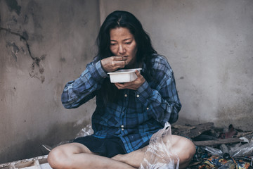 poor people,homeless or beggar begging for help sitting at dirty slum.concept for poverty...