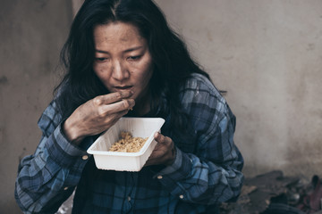 poor people,homeless or beggar begging for help sitting at dirty slum.concept for poverty...